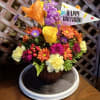 Colorful mixed bouquet in a vase with a Happy Birthday sign