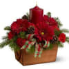 Red candle centerpiece with red flowers in a wooden box