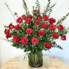 Tall bouquet of red roses in a glass vase
