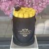Beautiful yellow roses in our signature black box.