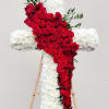 Red rose cross with white flowers on a wooden easel
