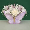 A charming butterfly-shaped floral box featuring fresh roses, delicate accent flowers, and