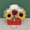 Fresh seasonal blooms arranged in our elegant purse box, featuring cheerful sunflowers