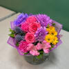 A beautiful hand-tied bouquet featuring a colorful mix of fresh seasonal flowers