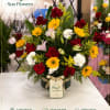 A joyful, rounded floral gift that says "I'm thinking of you" with