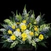 Large yellow and white floral arrangement in a basket