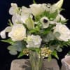 White floral bouquet in a clear glass vase