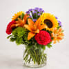 Bursting with warmth and vibrant color, Sunset Celebration Bouquet&trade; is a stunning