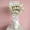 Bouquet of white roses with baby's breath in white and gold wrap