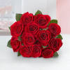 Bouquet of red roses with green leaves