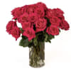 Bouquet of bright pink roses in a clear glass vase