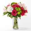 Bouquet of pink and white flowers in a clear glass vase
