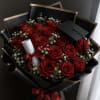 Deep, velvety red roses arranged in a tight, luxurious cluster make this