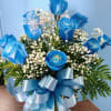 Vivid blue roses rise amid clusters of tiny white filler blooms in