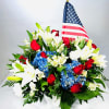 This beautiful white basket of flowers is perfect for any patriotic occasion!