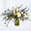 Sea Glass is an airy garden-style floral arrangement featuring white roses, delicate