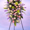 Whispers of the Garden is a graceful sympathy spray designed to reflect