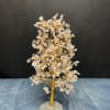 Wire gemstone tree with clear crystal chips on a faceted stone base
