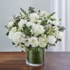 White rose bouquet in a clear glass vase