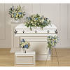 White casket with blue and cream floral sprays