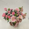 
A soft and romantic wicker basket arrangement featuring premium pink expression roses