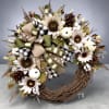 Autumn wreath with sunflowers, cotton bolls, pinecones, and ribbon bows