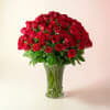 A lush dome of tightly clustered red roses creates an instant romantic