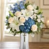 A calm, reverent arrangement that offers a gentle, comforting presence for sympathy