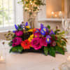 A vivid low centerpiece that brings an instant burst of joy to