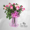 Bouquet of pink and peach roses tied with a pink ribbon