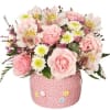 Pink roses and white alstroemeria in a pink decorative pot