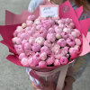 Large bouquet of pink peonies wrapped in bright pink paper