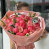 Pink tulip and rose bouquet wrapped in blush paper