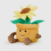 Plush sunflower toy with a smiling face and green leaves