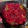 Bouquet of red roses with gold butterfly decorations and rhinestones