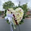 A touching display of love, this heart blooms with grace and remembrance