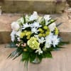 White and yellow mixed bouquet in a glass vase