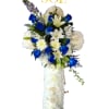 Tall white floral standing spray with blue roses and lilies