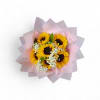 Bouquet of sunflowers wrapped in pink paper