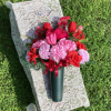 An arrangement of weather resistant silk flowers perfect for display at a