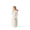 Small carved figurine of a girl in a white dress with a red bird on her shoulder