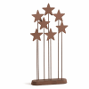Brown metal star-shaped tabletop decoration on a base