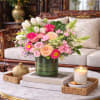A lush garden-inspired floral arrangement featuring Enchanted garden roses, elegant tulips, soft