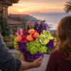 Colorful mixed bouquet in a vase held at a doorway overlooking the ocean