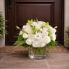 This elegant and sophicated floral display includes Umbrella fern, White hydrangea, White