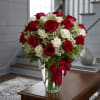 (ALL-ROUND) Red and white roses with delicate white filler in a clear