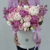Large pink and white bouquet in a round white box