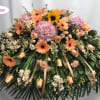 Sweet Peaches is a graceful casket cover designed to honor a cherished