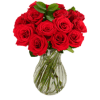 Red roses arranged in a clear glass vase