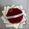Classic red roses wrapped in white paper with elegant gold details, finished